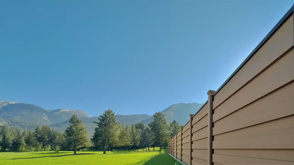 Trex Horizons horizontal composite privacy fence along a lawn